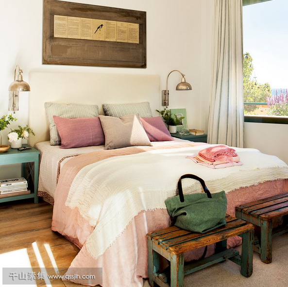 04-The-master-bedroom-is-furnished-with-shabby-chic-and-vintage-items-and-the-color-palette-is-a-pastel-one-the-views-are-also-present.png