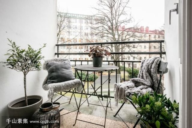 08-a-small-balcony-with-folding-furniture-potted-greenery-and-candles-for-having-meals.jpg