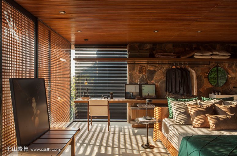 03-The-master-bedroom-is-done-with-wooden-screens-stone-wood-and-leather-and-theres-an-open-storage-space-775x510.jpg